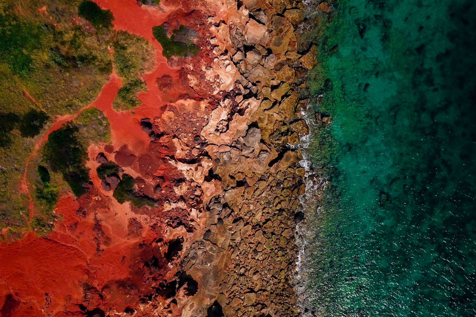 Upgrading iron ore for direct reduced iron production using products from seawater reverse osmosis brines